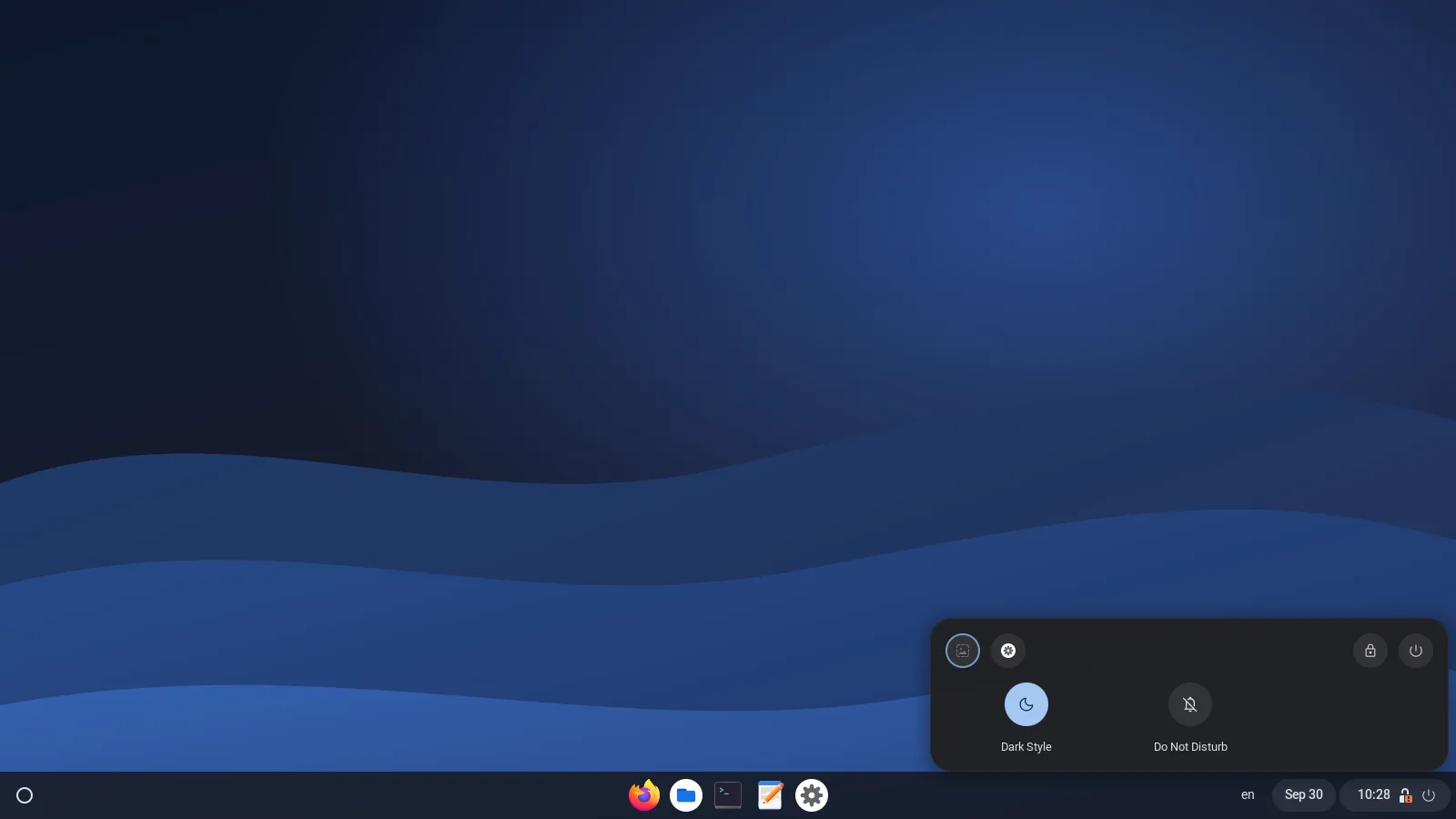 Dark theme: quick settings open above the status tray on the shelf