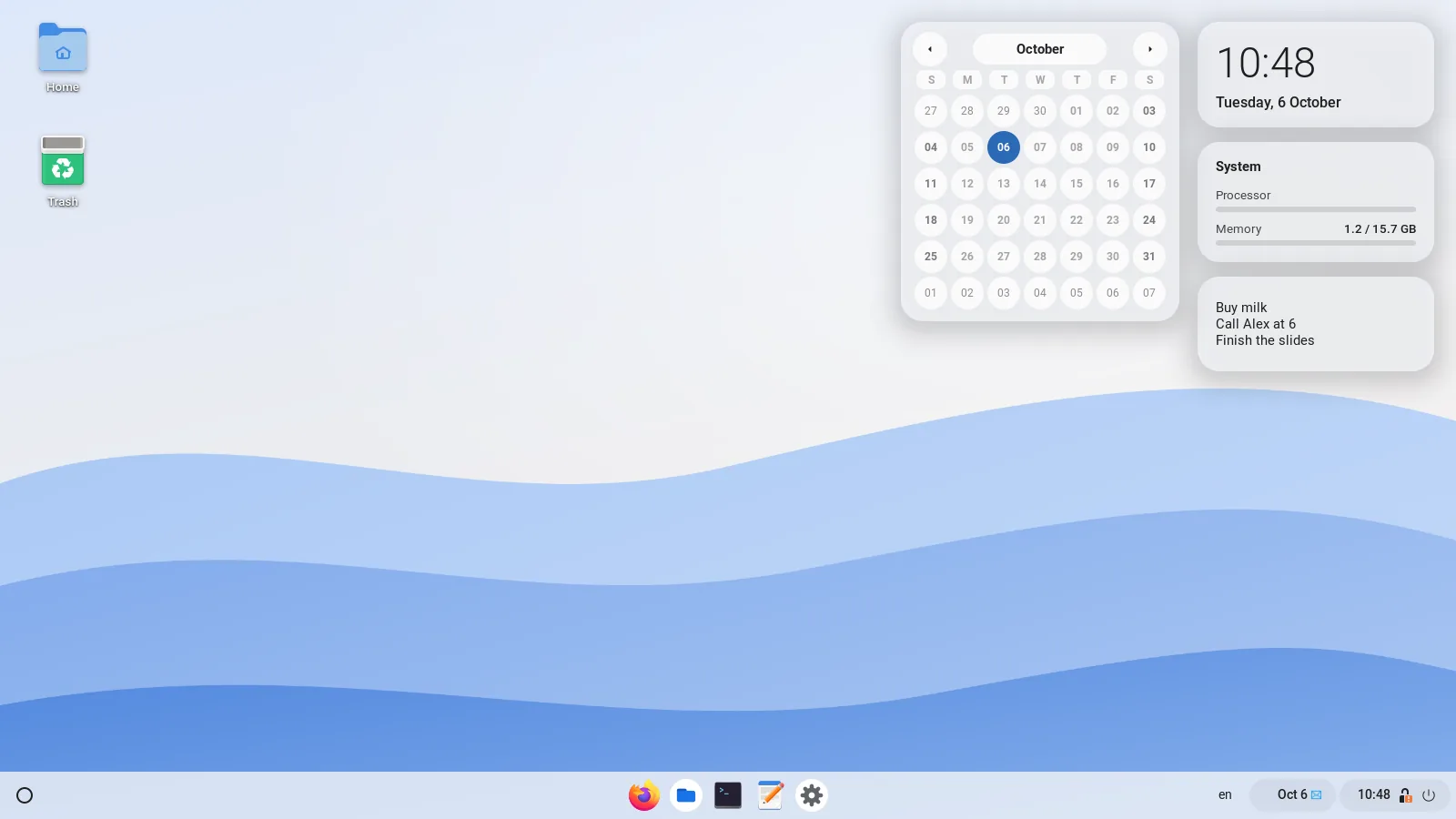 Desktop with widgets: calendar, clock, system load and a note